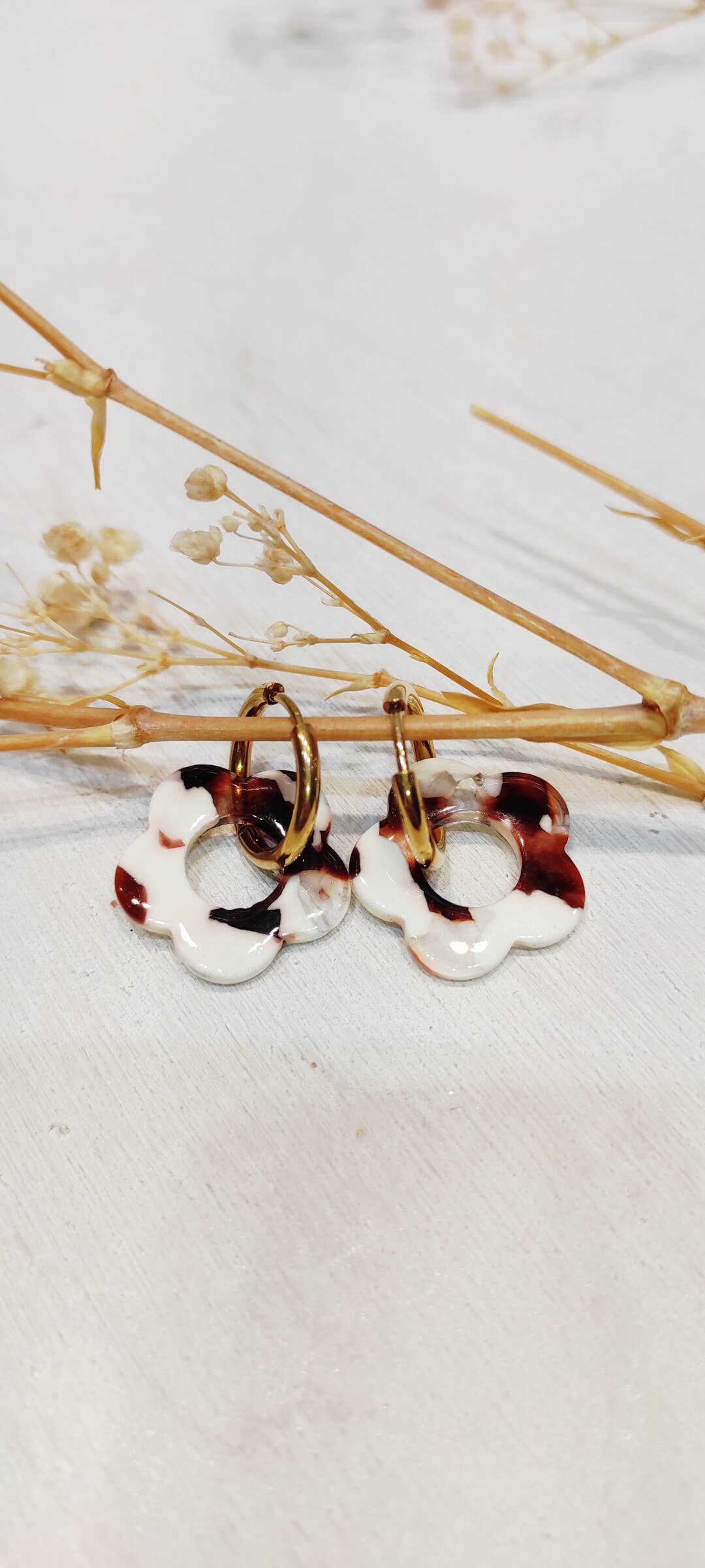 Boucle d'oreille fleur à motifs