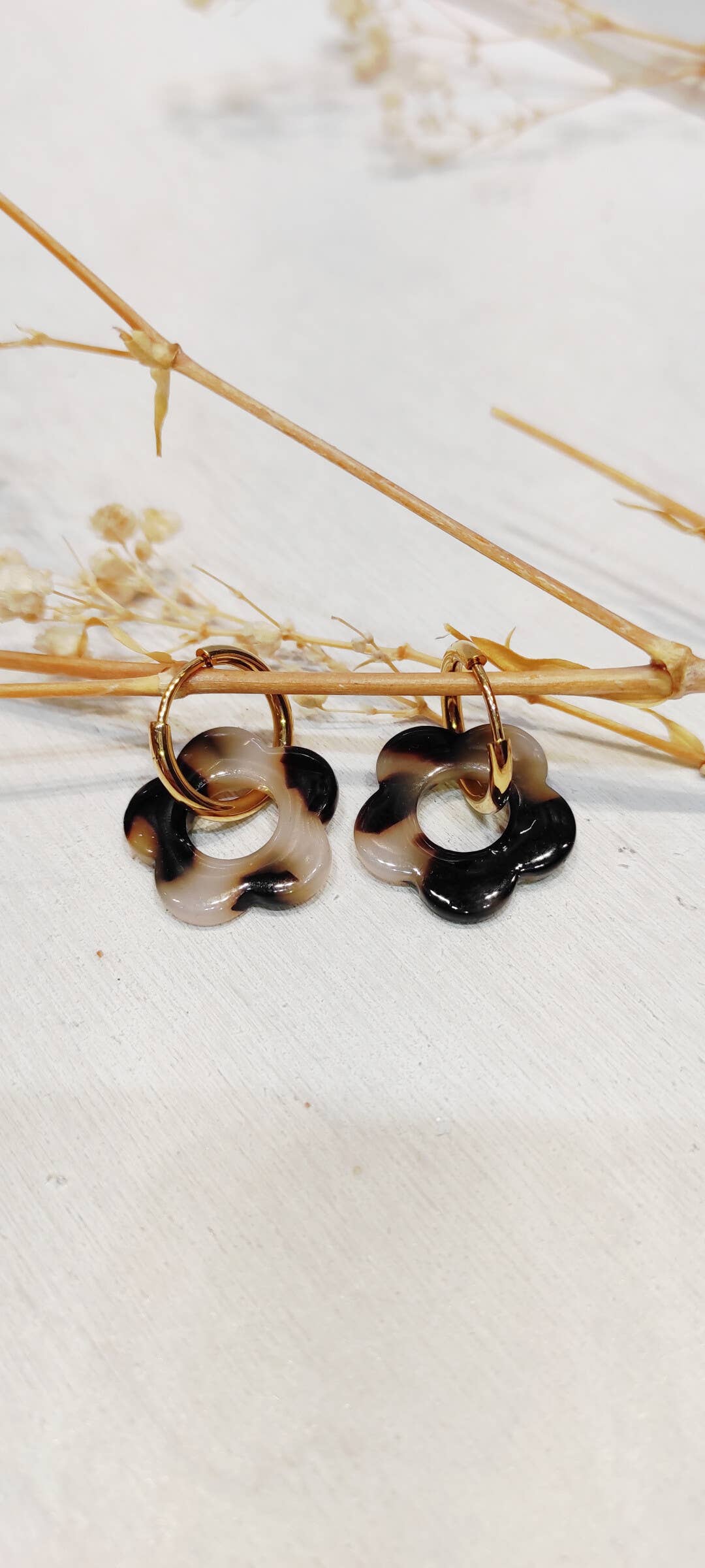 Boucle d'oreille fleur à motifs